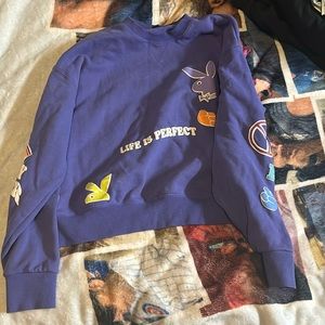 Playboy crewneck size xtra small fits small and is purple